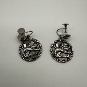 Vintage Enco silver screw-back earrings featuring a heraldic lion passant design